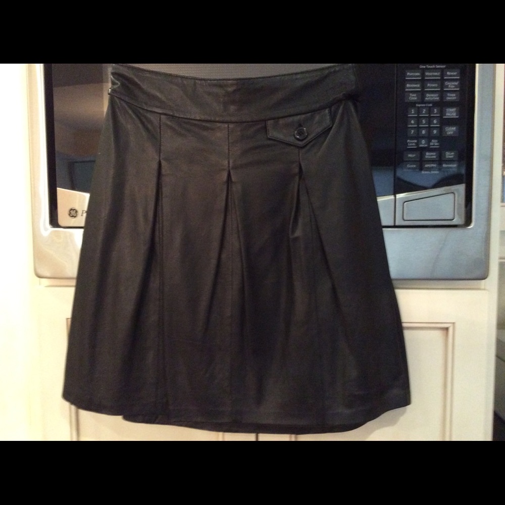 Black leather pleated mini skirt